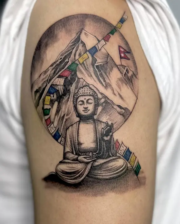 Buddha with Mount Everest, prayer flags and Nepal flag shoulder tattoo by Diya Tattoo, Kathmandu