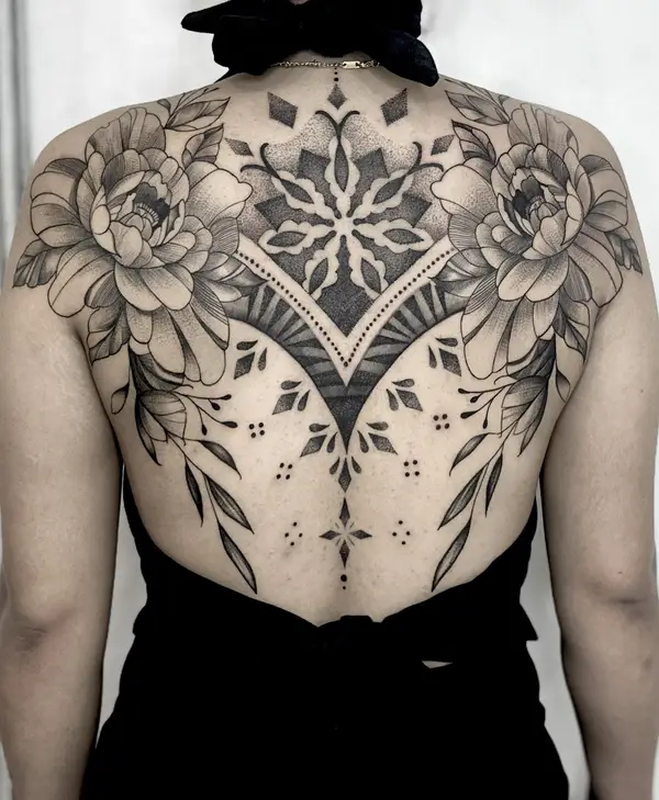 Ornamental dotwork back piece with peony flowers by female tattoo artist Diya in Kathmandu, Nepal